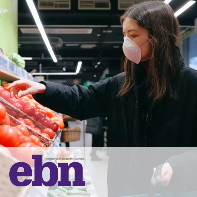EBN news article featuring a woman in a mask picking tomatoes from the grocery store.
